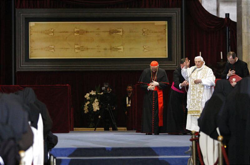Pope Benedict XVI, in white, delivers his message in front of the shroud in Turin, Italy, on Sunday.
