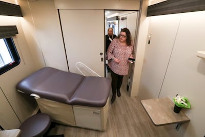 Fourth Street Clinic patient Maggie Grimyser tours the clinic’s new mobile clinic in Salt Lake City on Thursday, May 9, 2019. The mobile clinic, with three exam rooms staffed by medical providers, is expected to start serving clients at partner agencies a