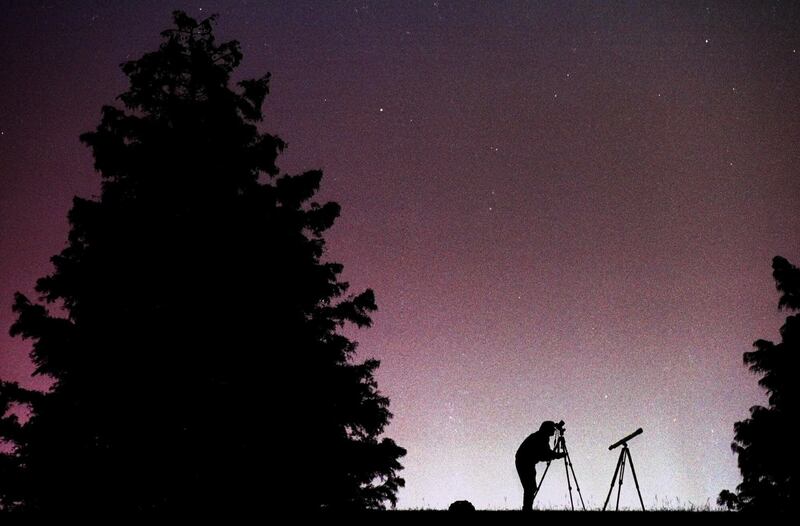 Montgomery, Ala., photographer and avid stargazer Jay Sailors aims his camera toward the constellation Leo in the eastern sky in an effort to capture images of the Leonid meteor shower early Thursday, Nov. 18, 1999. Clear skies were abundant across the So