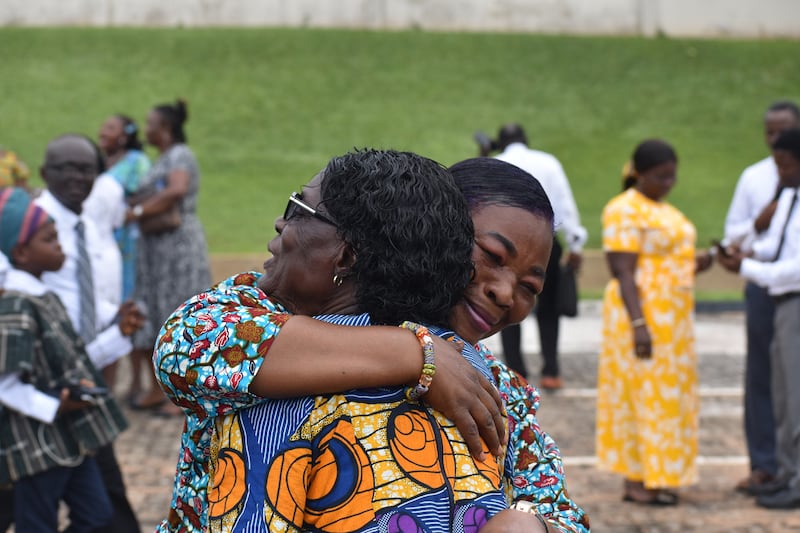 Friends greet each other at the groundbreaking for the Kumasi Ghana Temple on Saturday, Oct. 18, 2025, in Kumasi, Ghana.