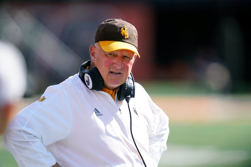 Wyoming coach Craig Bohl looks around his team’s bench during a game against Illinois, Aug. 27, 2022, in Champaign, Ill.