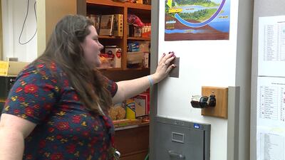 Krista Gibbons turns on the light in her classroom's food pantry in West Jordan, Tuesday, Dec. 11, 2018.