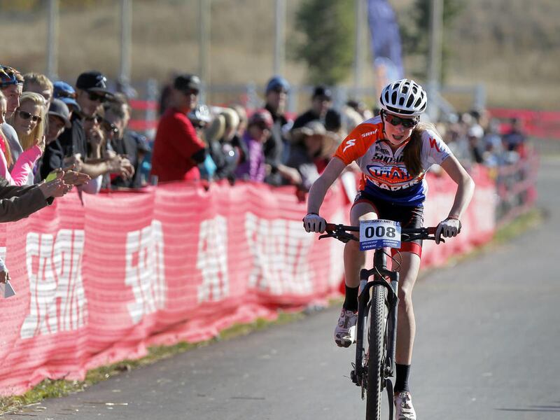 Haley Batten rides thorough the finish area during the Utah High School Cycling League Mountain Bike race at Soldier Hollow October 26, 2013 in Heber City, Utah (Photo/Steve C. Wilson)