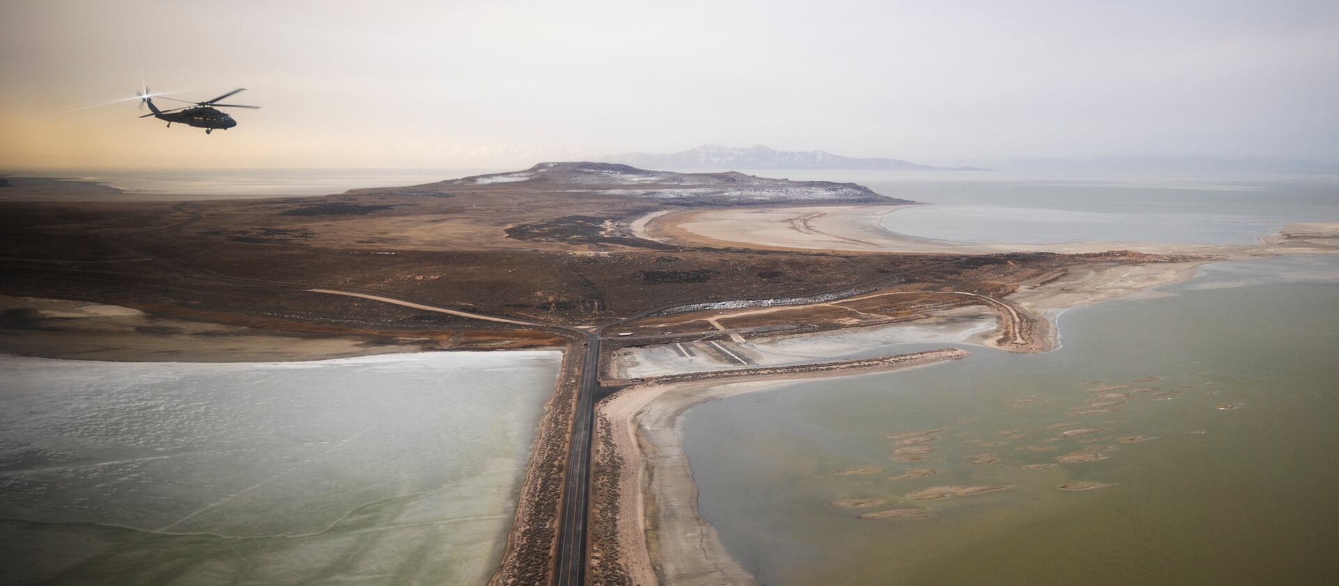 A Utah Army National Guard Black Hawk helicopter carrying lawmakers flies over the Great Salt Lake on Tuesday, Feb. 15, 2022.