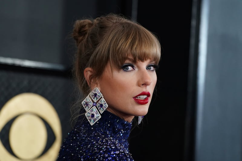 Taylor Swift arrives at the 65th annual Grammy Awards.