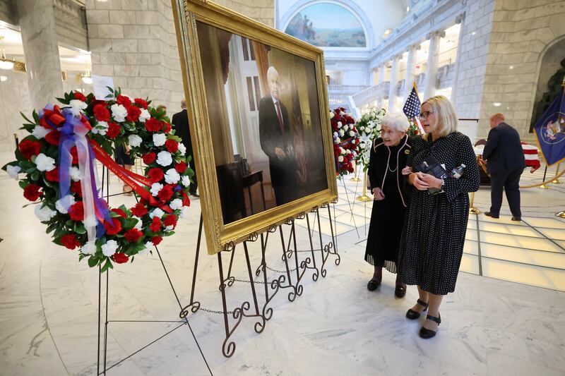 Elaine Hatch looks at a large portrait of the former Sen. Orrin Hatch at a viewing service after he passed away.