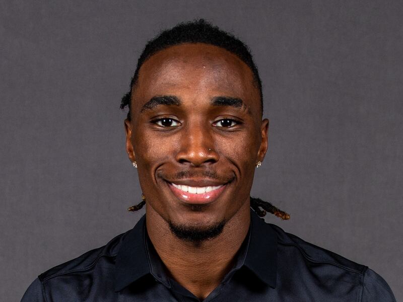 Photo of Aaron Lowe, wearing a black polo