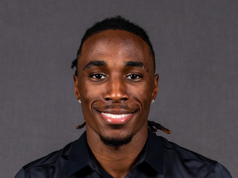Photo of Aaron Lowe, wearing a black polo