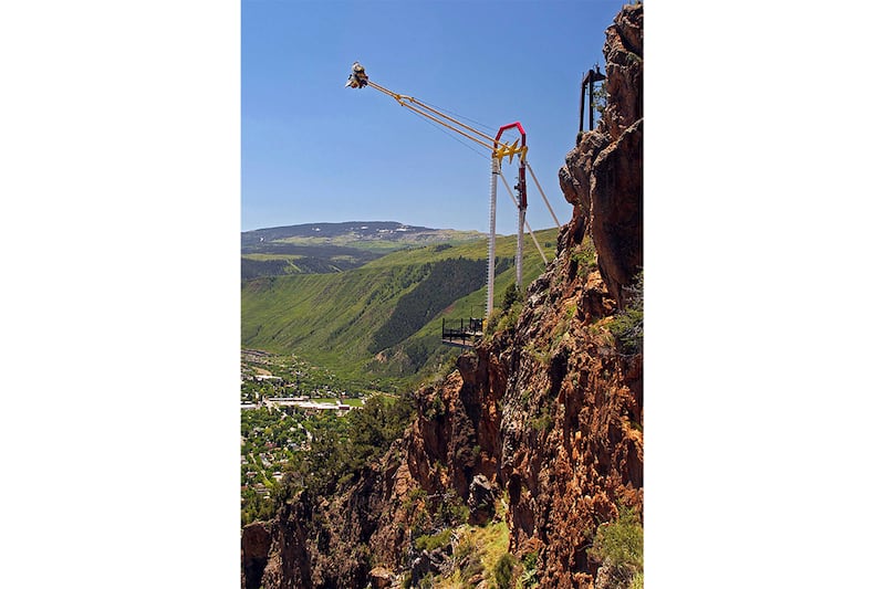 People ride the Giant Canyon Swing at Glenwood Caverns Adventure Park in Glenwood Springs, Colorado.