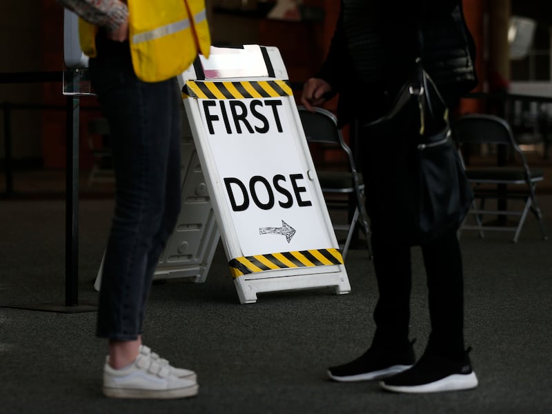 A sign directs people toward COVID-19 vaccines.