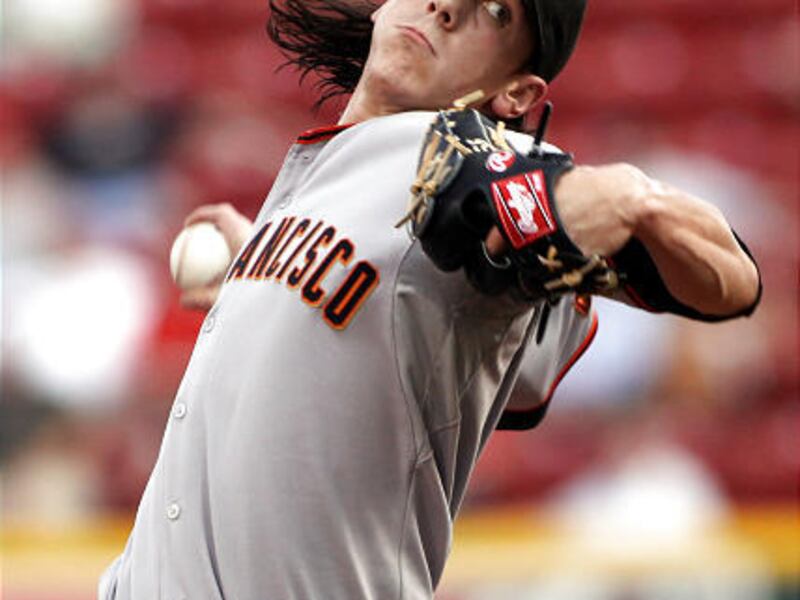 San Francisco Giants pitcher Tim Lincecum throws the ball against the Cincinnati Reds during the first inning Tuesday.