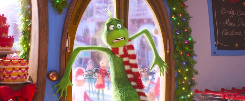 The Grinch (Benedict Cumberbatch) is confronted by the unchecked Christmas joy of Whoville in “The Grinch.”