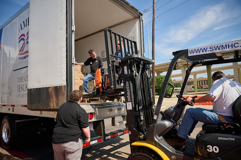Catholic Charities Dallas employees and volunteers help unload boxes from the food donation made by The Church of Jesus Christ of Latter-day Saints to Joe's Pantry in Dallas, Texas, on Thursday, May 14, 2026.