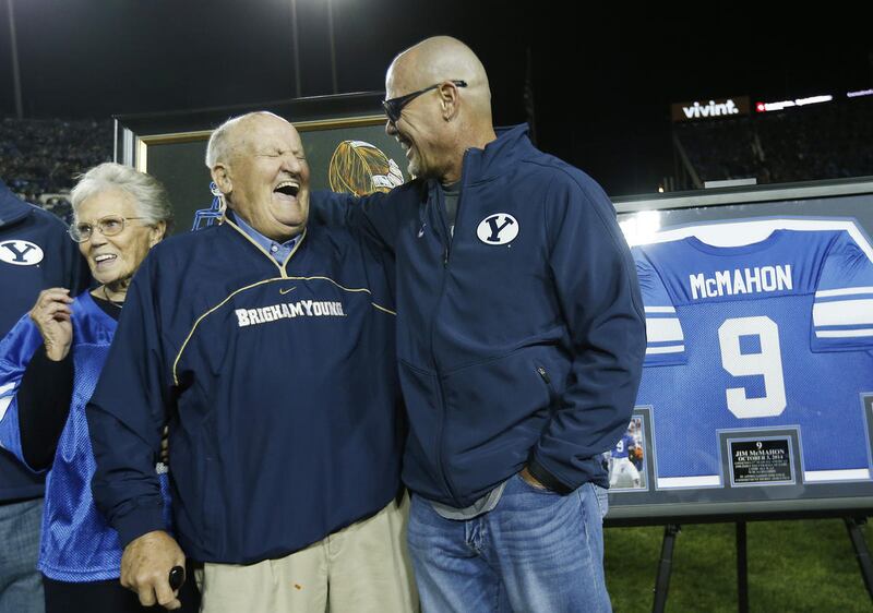 Former Cougar QB Jim McMahon and former coach Lavell Edwards laugh as he is honored at halftime in Provo Friday, Oct. 3, 2014.