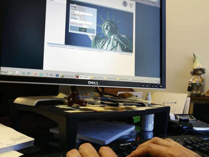 An unidentified human resource manager logs in to the E-Verify system from her office in Salt Lake City in this Monday, July 11, 2011 file photo.