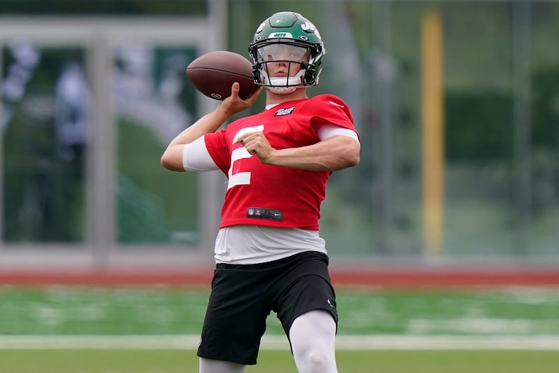 New York Jets quarterback Zach Wilson drops back for a pass during NFL football practice.