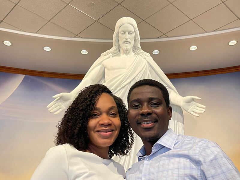 Stephanie and Nowah Afangbedji in front of the Christus statue in the Washington D.C. Temple Visitors’ Center.