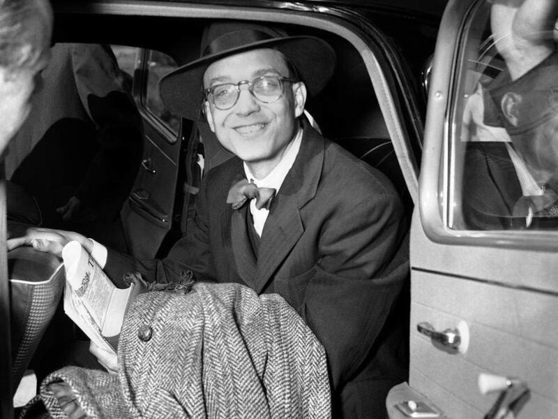 FILE - The May 16, 1953 file photo shows William Oatis, Associated Press correspondent.smiling as he crosses Czech border into American sector of West Germany at Waidhaus after his release from a Czech prison. Of some 240,000 unlawfully jailed in Czechos