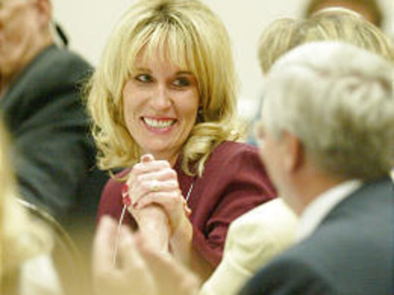 Ember Eskelson Storrs is congratulated by other teachers after winning the Utah Teacher of the Year award at a banquet Friday night.