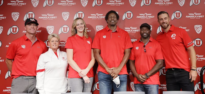 Members of the 2021 Utah Athletics Hall of Fame class, Casey Child, left, Amy Timmel-Hogue, Lori Baird, Anthony Brown, Eddie Johnson and Alex Smith, pose for a photo in Salt Lake City.