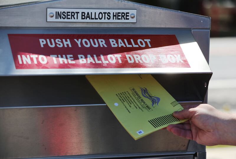 A ballot is dropped off at West Valley City Hall in West Valley on Sept. 5, 2023.