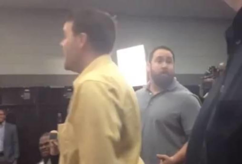 Panthers offensive lineman Ryan Kalil serenades teammate Jordan Gross at a press conference. Photo from YouTube.com.