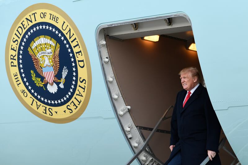 FILE - In this April 15, 2019, file photo, President Donald Trump walks down the steps of Air Force One at Andrews Air Force Base in Md. Four California voters have sued Monday, Aug. 5, 2019, to block a new state law aimed at forcing Republican President