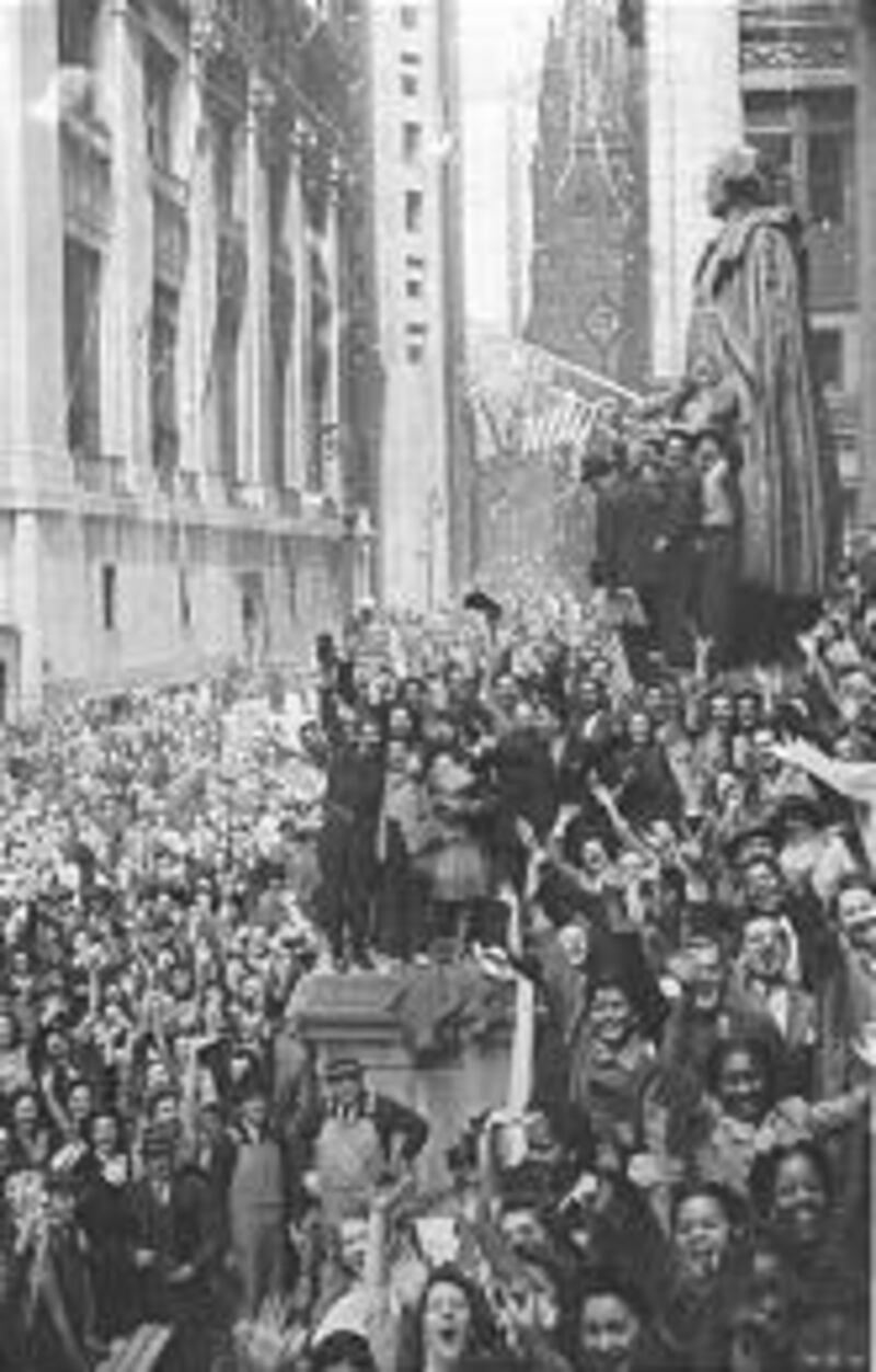 Thousands jam Wall Street on May 7, 1945, to celebrate Germany’s surrender. The Allies accepted the following day, known as V-E Day.