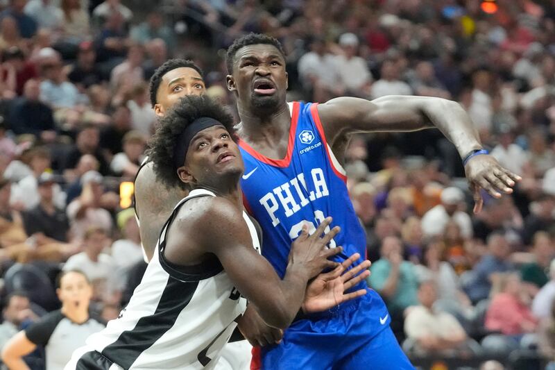 Utah Jazz forward Taylor Hendricks, left, and Philadelphia 76ers center Adem Bona, right, battle for position under the boards during the second half of an NBA summer league basketball game Wednesday, July 10, 2024, in Salt Lake City. (AP Photo/Rick Bowmer)
