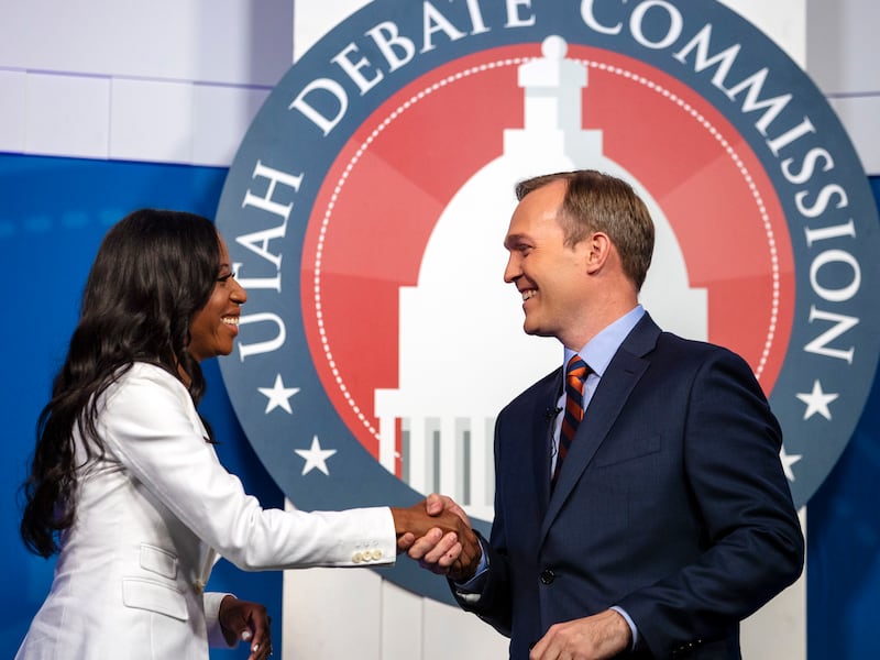 FILE - U.S. Rep. Mia Love and Salt Lake County Mayor Ben McAdams shake hands as they take part in a debate at the Gail Miller Conference Center at Salt Lake Community College on Monday, Oct. 15, 2018, in Sandy, Utah, as the two battle for Utah's 4th Congr