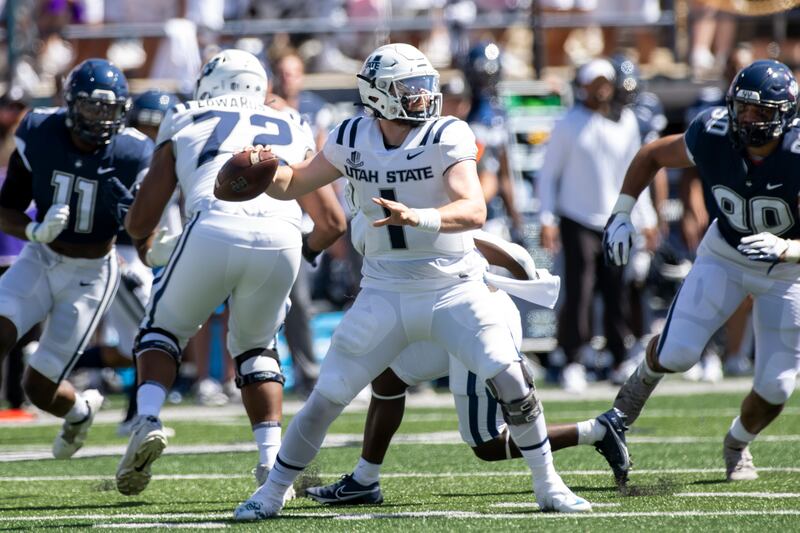 Utah State Aggies quarterback Logan Bonner (1) looks to pass during an NCAA football game on Saturday, Aug. 27, 2022 in Logan.