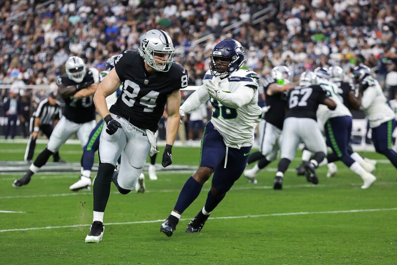 Las Vegas Raiders’ tight end Matt Bushman (84) runs down the field during a preseason game against Seattle.