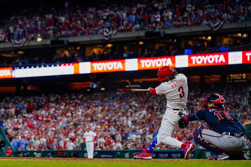 Philadelphia Phillies’ Bryce Harper hits a home run during Game 3 of a baseball NL Division Series against the Atlanta Braves Wednesday, Oct. 11, 2023.
