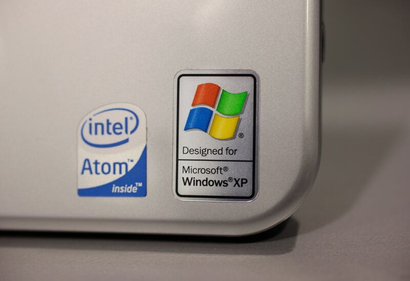 This July 22, 2009, file photo shows a Windows XP logo on a Hewlett Packard Laptop at a Best Buy in Mountain View, Calif.