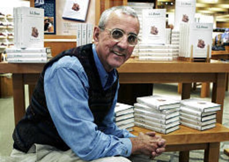 Leon Gorman, grandson of L.L. Bean, sits by table loaded with copies of his memoir, "L.L. Bean: The Making of an American Icon."