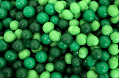Green pieces of candy are sorted out for an installation in Macy's Candy Windows at Salt Lake Community College in Salt Lake City on Monday, Oct. 22, 2018.