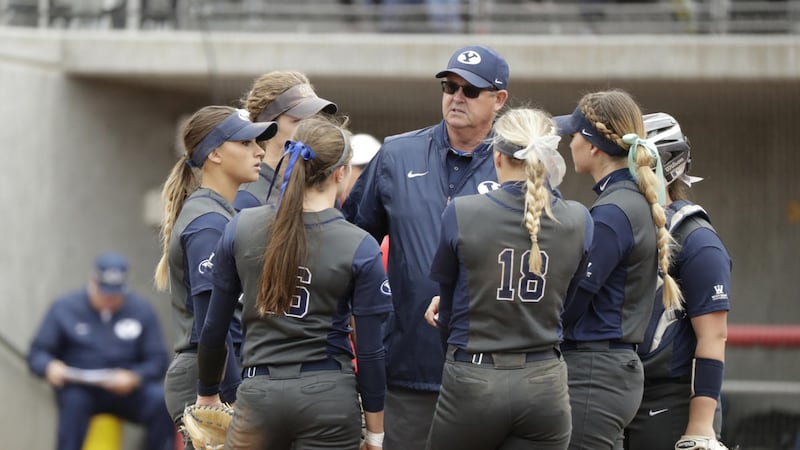 Pete Meredith (center) talks to BYU softball players. Head softball coach Gordon Eakin announced the promotion of Meredith to associate head softball coach Wednesday.