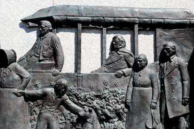 Details on sculptor Mahonri Young’s This Is the Place Monument include a scene showing pioneer leader Brigham Young, who was ill (and who was the artist’s grandfather), riding in the carriage of his friend Wilford Woodruff, as they approach the Salt Lake