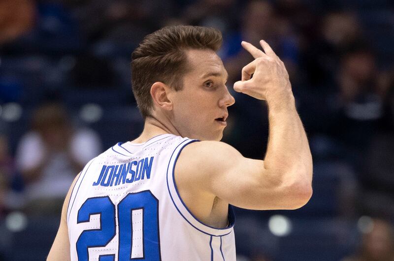 Brigham Young Cougars guard Spencer Johnson (20) holds up three fingers after scoring in the game against San Diego State at BYU’s Marriott Center in Provo on Friday, Nov. 10, 2023.