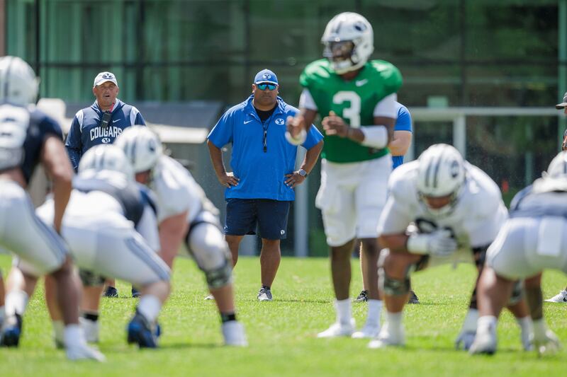 BYU head coach Kalani Sitake looks on during the Cougars' first full scrimmage of fall camp in Provo.