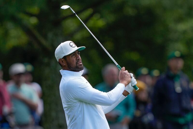 Tony Finau hits from the fairway on the eighth hole during the final round of the Masters golf tournament at Augusta National Golf Club on Sunday, April 9, 2023, in Augusta, Ga. (AP Photo/David J. Phillip)