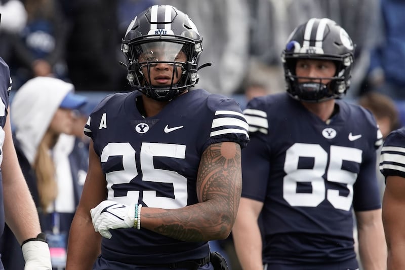 BYU running back Tyler Allgeier (25) warms up ahead of an NCAA college football game against Boise State.