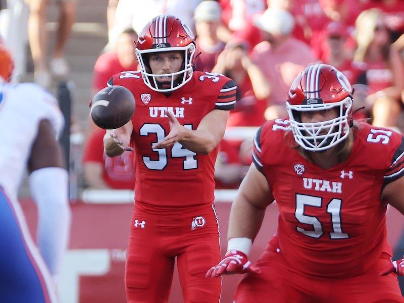 Utah Utes punter Jack Bouwmeester (34) punts during game against Florida in season opener at Rice-Eccles Stadium.