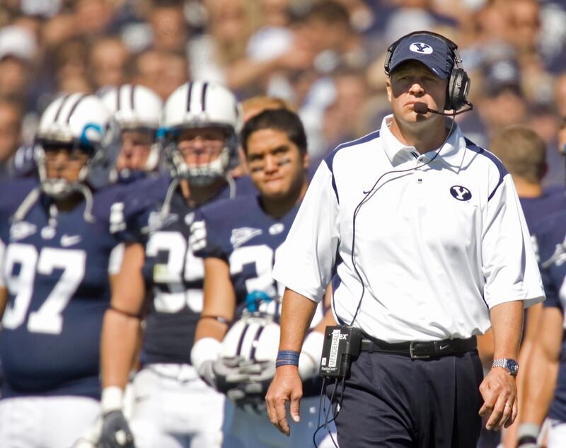 BYU football coach Bronco Mendenhall walks the sideline during a game against UCLA in Provo, Utah.