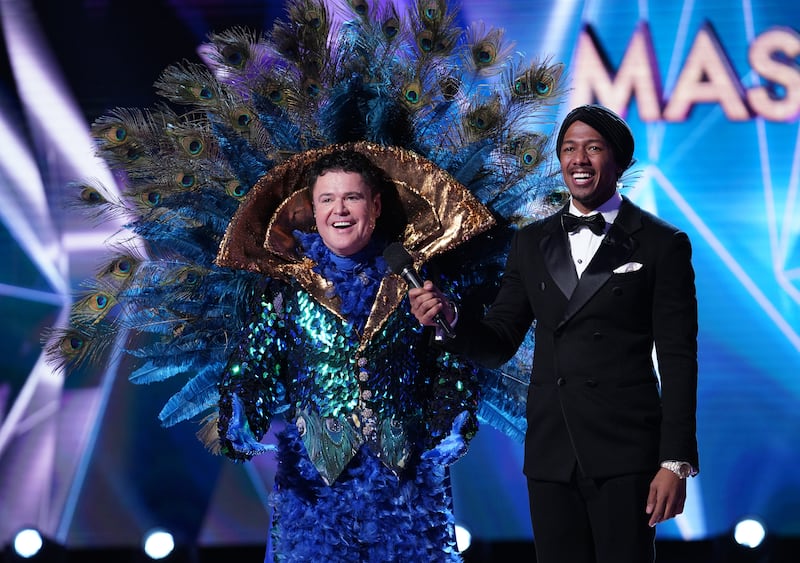 Donny Osmond and host Nick Cannon in the special two-hour "Road to the Finals / Season Finale: The Final Mask is Lifted" episode of "The Masked Singer."