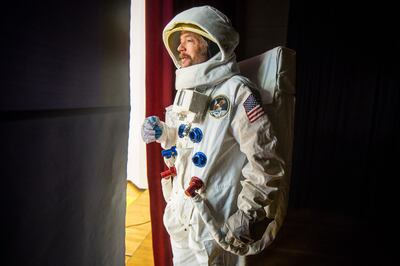 Boo Crandall, dressed as a spaceman, waits backstage before the announcement of a $1 million commitment from the Edward St. John Foundation toward a new space center and planetarium in Utah Valley at Central Elementary School in Pleasant Grove on Monday,