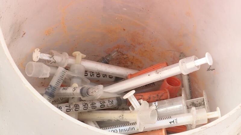 Used needles that were left behind at a homeless camp in Salt Lake City are pictured on Thursday, May 9, 2019. They were picked up along with thousands of pounds of trash and delivered to a landfill.