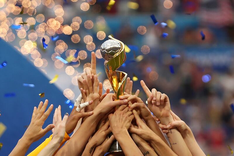The United States players hold the trophy as they celebrate winning the 2019 Women’s World Cup final soccer match.