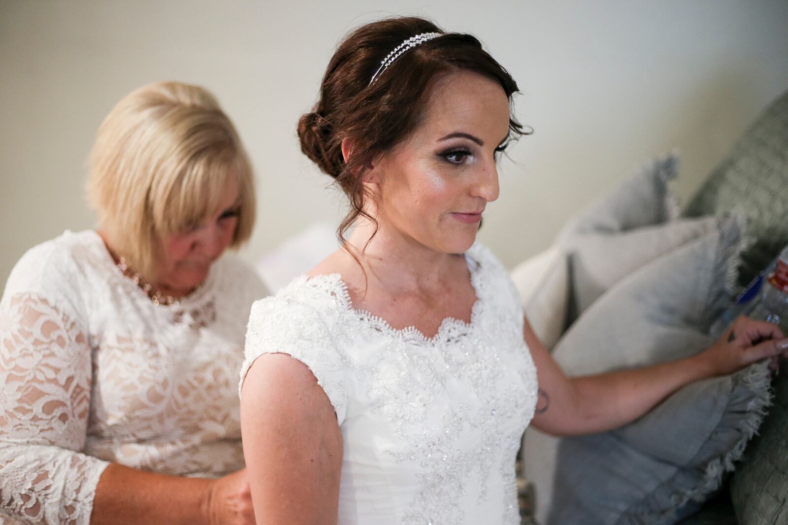 Whitney Morrill gets help from her mother, Karren, to put on her dress before getting married in Alpine on Saturday, Aug. 5, 2017.