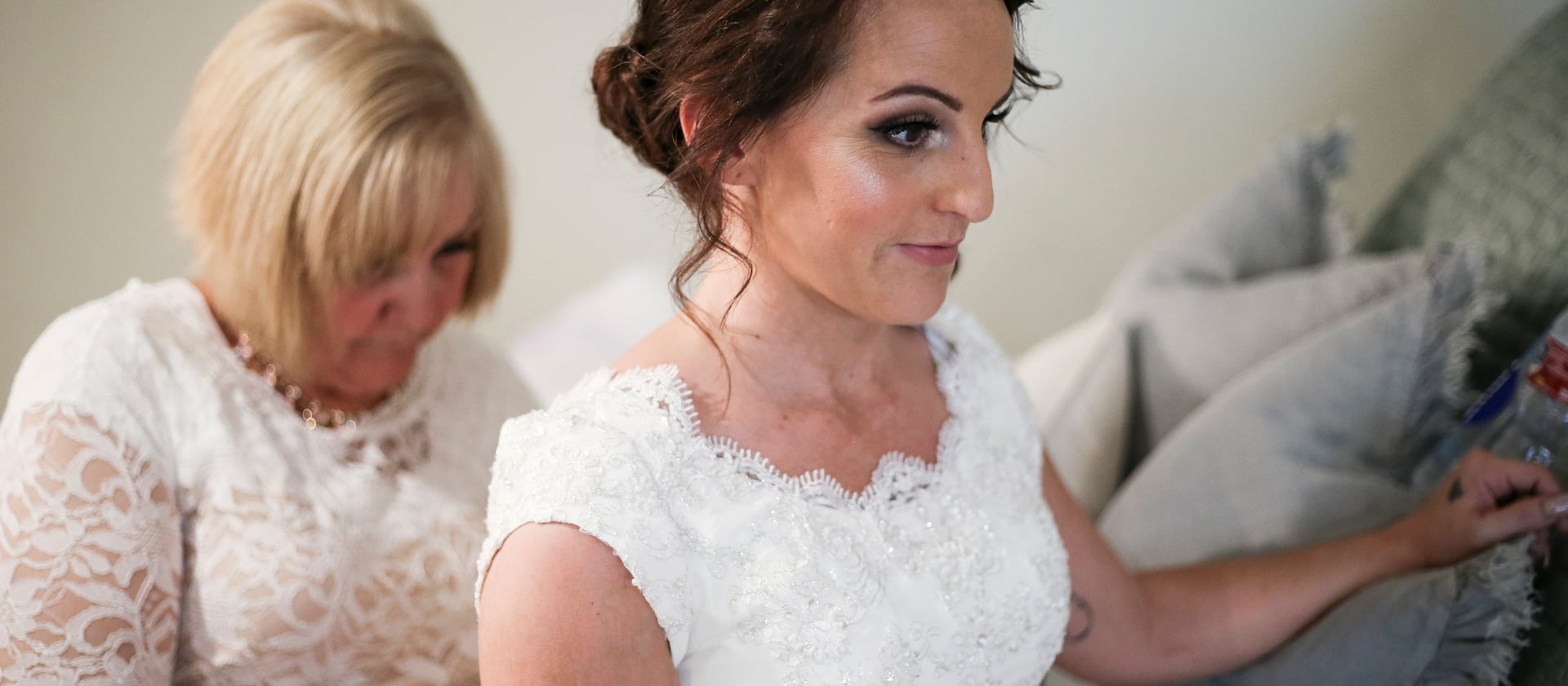 Whitney Morrill gets help from her mother, Karren, to put on her dress before getting married in Alpine on Saturday, Aug. 5, 2017.